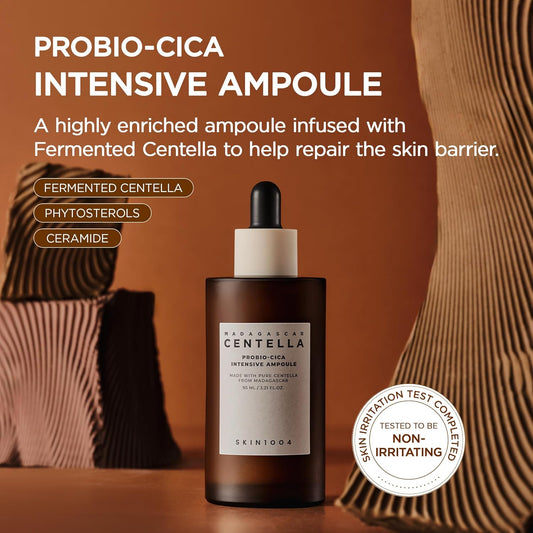 Promotional image of SKIN1004 Madagascar Centella Probio-Cica Intensive Ampoule featuring a 95ml amber dropper bottle. Highlights fermented Centella, phytosterols, and ceramides to help repair the skin barrier, nourish sensitive skin, and provide intensive hydration. Includes non-irritating skin test certification and Korean skincare benefits.