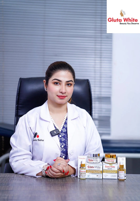 Woman in a white coat sitting at a desk with Gluta White products in front of her.