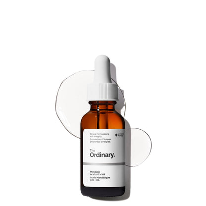 Product image of The Ordinary Mandelic Acid 10% + HA serum in a brown glass dropper bottle. This gentle exfoliating facial serum combines 10% Mandelic Acid and Hyaluronic Acid to improve skin texture, boost radiance, reduce dullness, and provide hydration for a smoother, brighter-looking complexion.