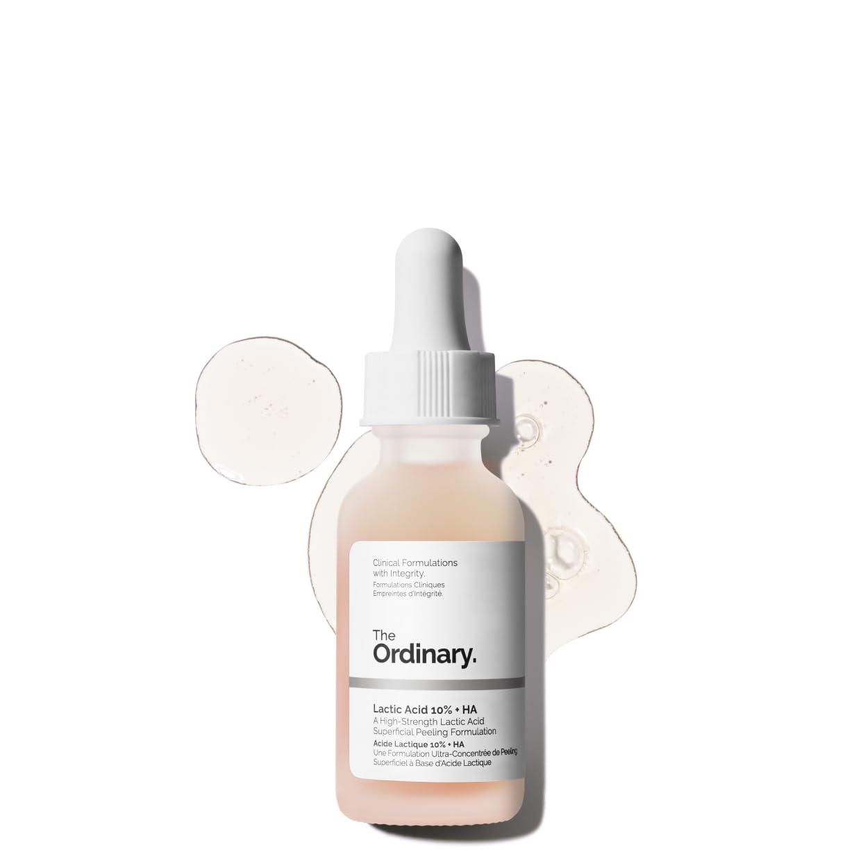 Product image of The Ordinary Lactic Acid 10% + HA serum in a frosted glass dropper bottle. The high-strength AHA exfoliating serum is displayed with clear serum texture swatches in the background, highlighting its lightweight formula designed to smooth skin texture, brighten dull skin, and improve overall radiance.