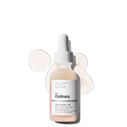 Product image of The Ordinary Lactic Acid 10% + HA serum in a frosted glass dropper bottle. The high-strength AHA exfoliating serum is displayed with clear serum texture swatches in the background, highlighting its lightweight formula designed to smooth skin texture, brighten dull skin, and improve overall radiance.