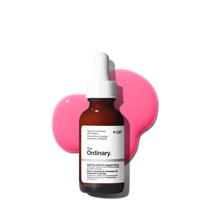 The Ordinary Soothing & Barrier Support Serum displayed in an amber glass dropper bottle against a light background with vibrant pink serum texture behind it. The image highlights the serum’s redness-reducing, hydrating, and skin barrier-supporting formula designed for sensitive and irritated skin.