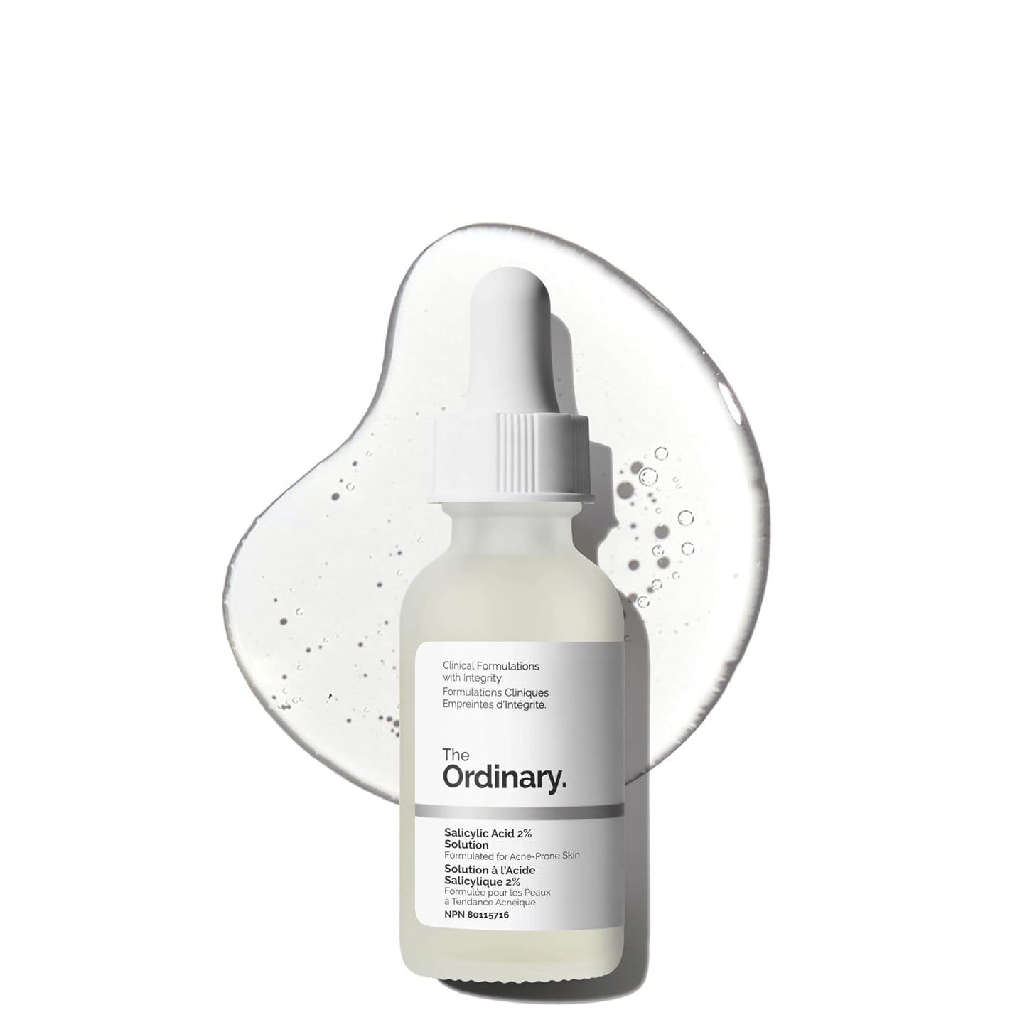 The Ordinary Salicylic Acid 2% Solution serum bottle displayed in front of a clear serum texture backdrop. Acne-fighting exfoliating serum formulated for blemish-prone skin, clogged pores, blackheads, and breakouts.