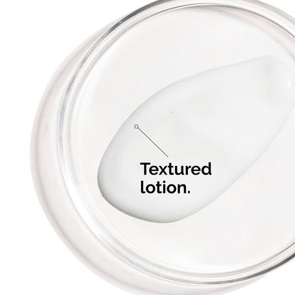 Close-up texture shot of The Ordinary Vitamin C Suspension 23% + Hyaluronic Acid Spheres 2%, showing the rich lotion-like consistency of the brightening Vitamin C skincare treatment.