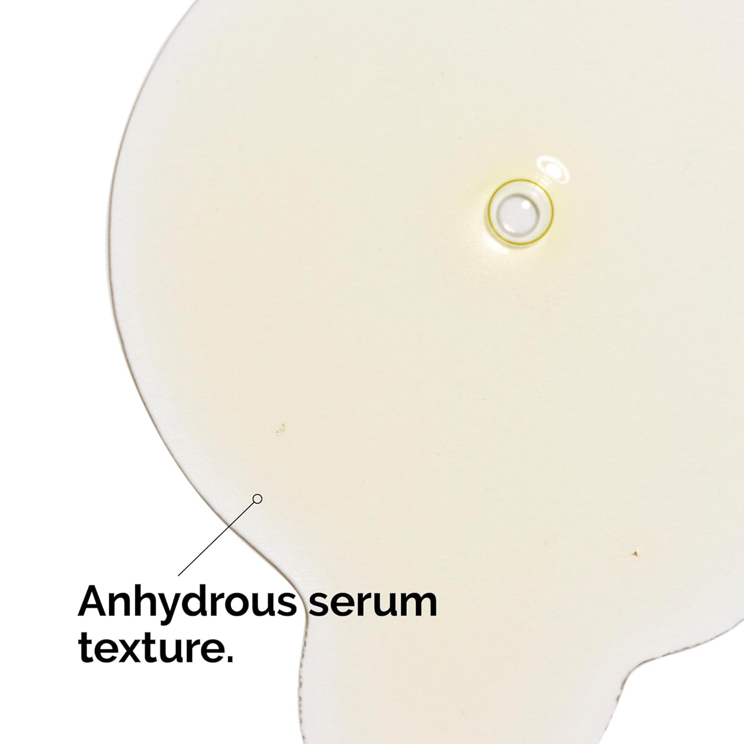 Close-up of The Ordinary Retinol 0.2% in Squalane serum texture spread on a white background, showcasing its lightweight anhydrous, water-free formula. The image highlights the smooth, nourishing texture designed to deliver retinol benefits while supporting skin hydration and minimizing irritation.