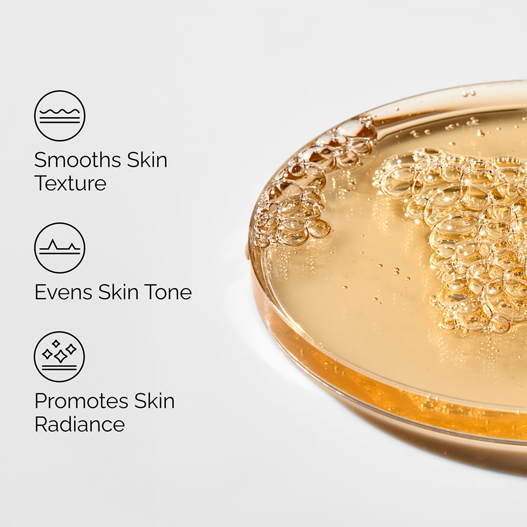 Benefit-focused graphic for The Ordinary Lactic Acid 5% + HA serum featuring a close-up of the golden serum texture. Highlights key skincare benefits including smoothing skin texture, evening skin tone, and promoting a brighter, more radiant complexion through gentle exfoliation. Ideal for improving dull, uneven-looking skin.