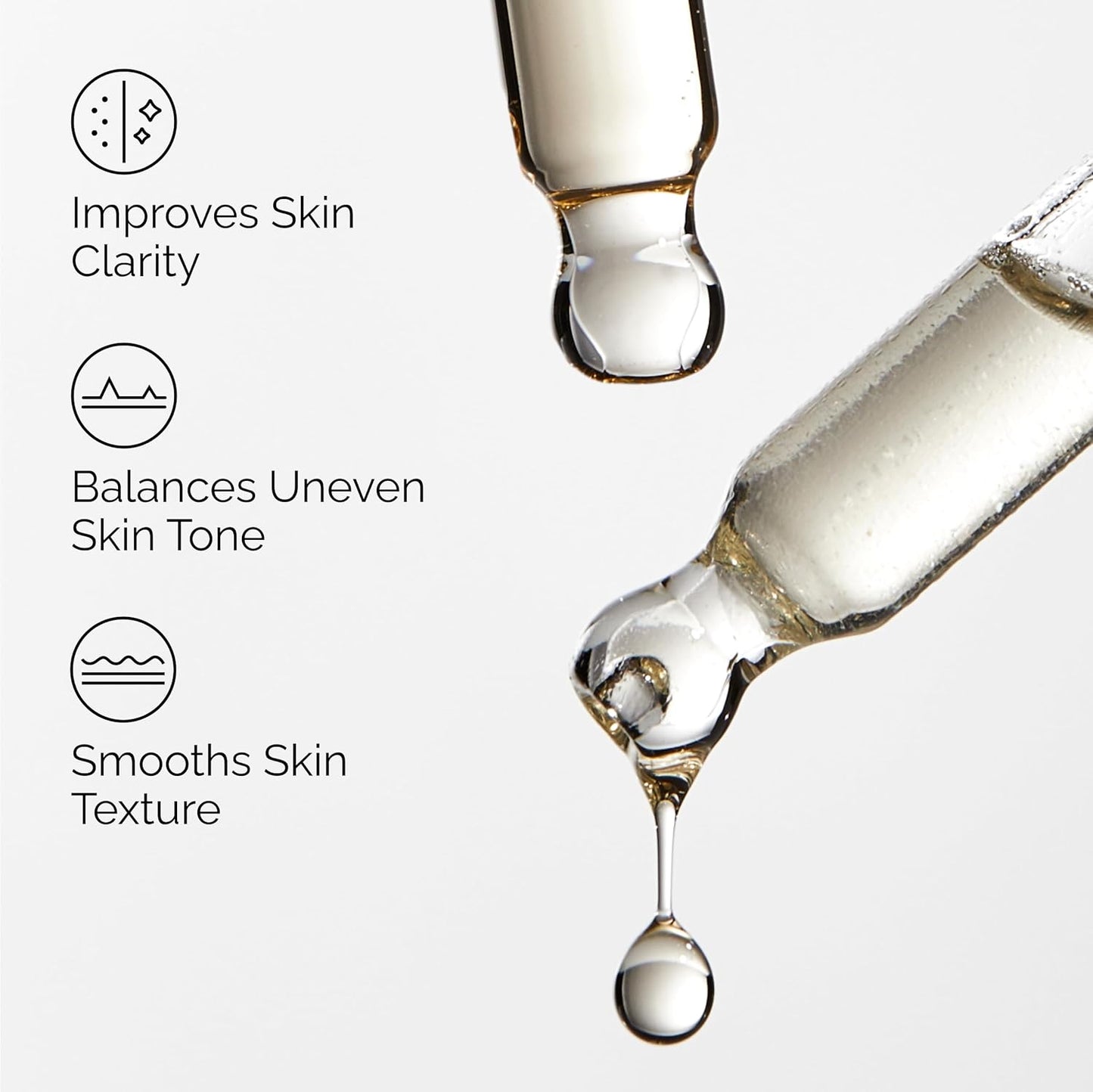 Close-up image of serum droplets from glass droppers highlighting the benefits of The Ordinary Mandelic Acid 10% + HA. The graphic emphasizes improved skin clarity, balanced uneven skin tone, and smoother skin texture through gentle exfoliation. Ideal for brightening dull skin and promoting a more even, radiant complexion.