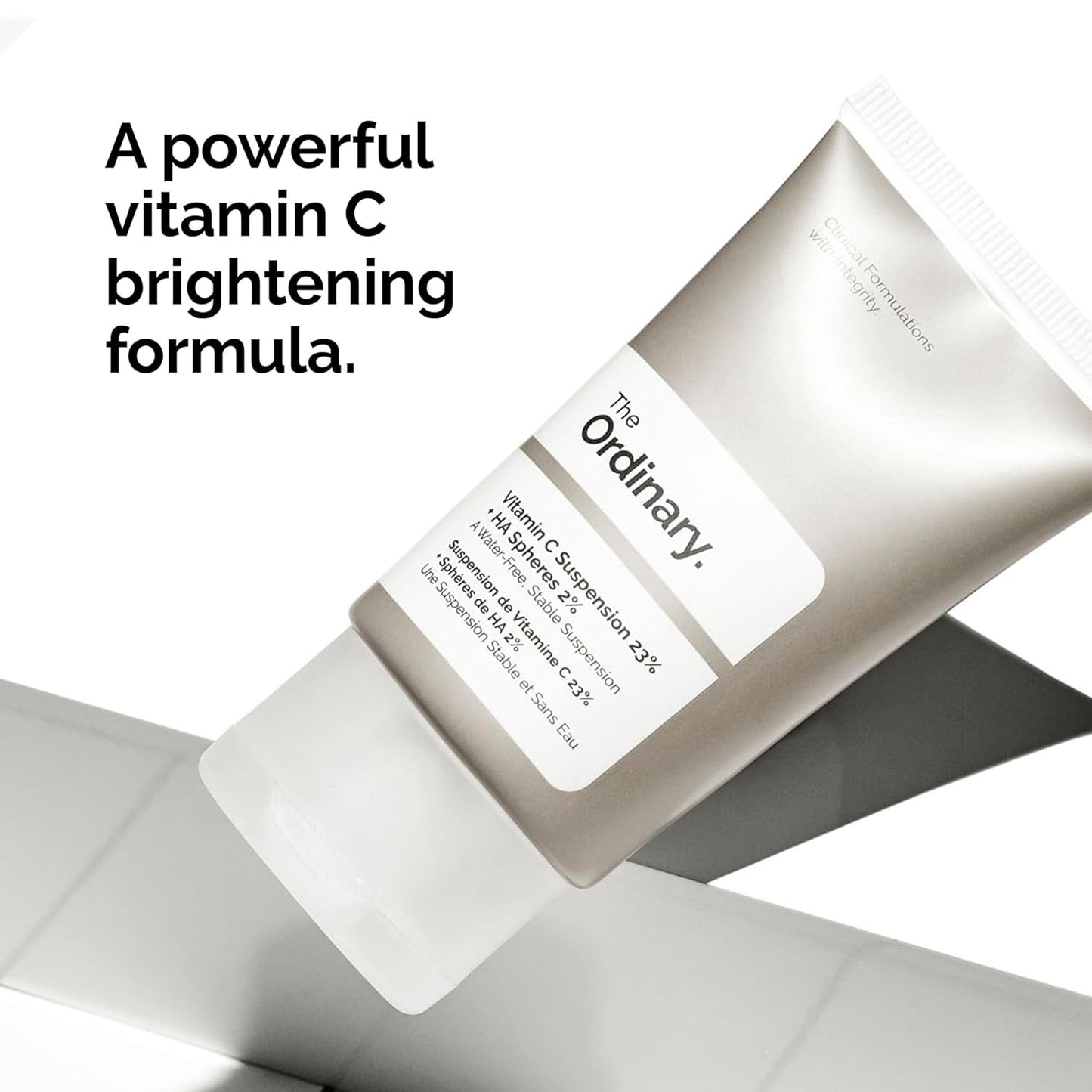 The Ordinary Vitamin C Suspension 23% + Hyaluronic Acid Spheres 2% displayed with the message "A Powerful Vitamin C Brightening Formula," highlighting its skin-brightening, antioxidant, and uneven skin tone correcting benefits.