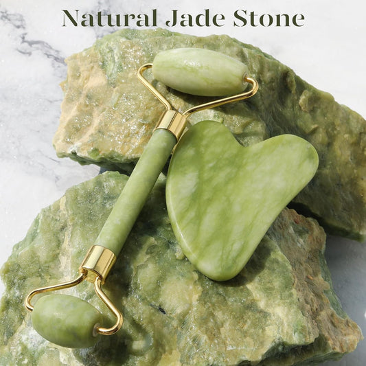 Jade facial roller on a natural jade stone background