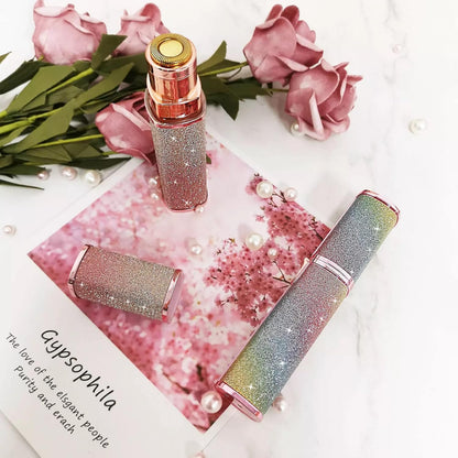 Decorative lip glosses with glittery finish on a pink floral background