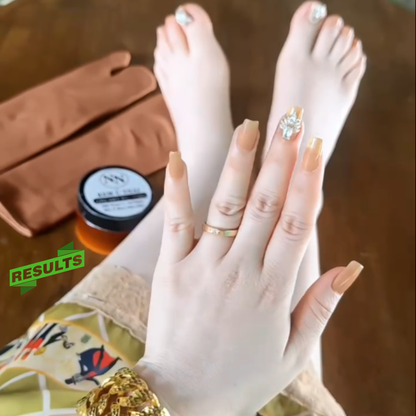 Close-up of hands and feet with polished nails, a jar, and a brown bag on a wooden surface.