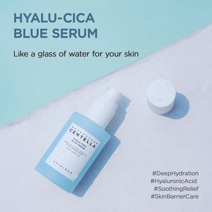 SKIN1004 Madagascar Centella Hyalu-Cica Blue Serum displayed on a blue background, highlighting deep hydration, hyaluronic acid, soothing care, and skin barrier support for healthy, moisturized skin.