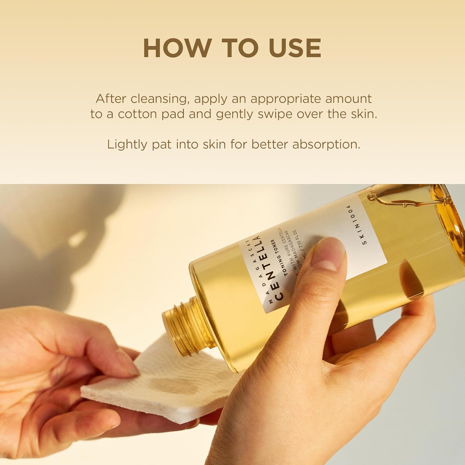 Instructional image showing how to use SKIN1004 Madagascar Centella Toning Toner 210ml. A person pours the toner onto a cotton pad after cleansing, demonstrating the recommended application method. The image highlights using an appropriate amount on a cotton pad, gently swiping across the skin, and lightly patting for better absorption. Infused with Madagascar Centella Asiatica to soothe, hydrate, and refresh the skin while maintaining a healthy skin barrier.