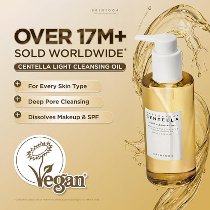Promotional image featuring SKIN1004 Madagascar Centella Light Cleansing Oil 200ml with a golden oil splash background. Highlights key benefits including suitability for all skin types, deep pore cleansing, and effective removal of makeup and sunscreen. The product is labeled vegan and showcases its lightweight Korean cleansing oil formula designed for daily double cleansing and pore care.