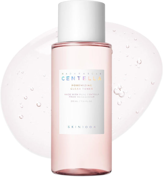 SKIN1004 Madagascar Centella Poremizing Clear Toner 210ml bottle with a soft pink toner formula displayed against a transparent gel backdrop, featuring Himalayan Pink Salt and Centella Asiatica for pore care, oil balance, hydration, and skin soothing.