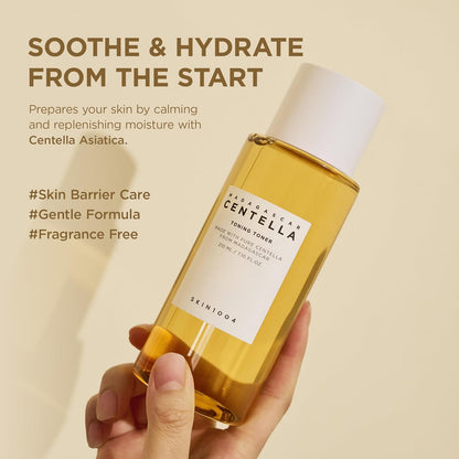 Hand holding SKIN1004 Madagascar Centella Toning Toner 210ml bottle. The image highlights the toner’s soothing and hydrating benefits with Centella Asiatica Extract, helping calm irritation, replenish moisture, support the skin barrier, and prepare skin for the rest of the skincare routine. Features a gentle, fragrance-free formula suitable for sensitive skin and daily use.