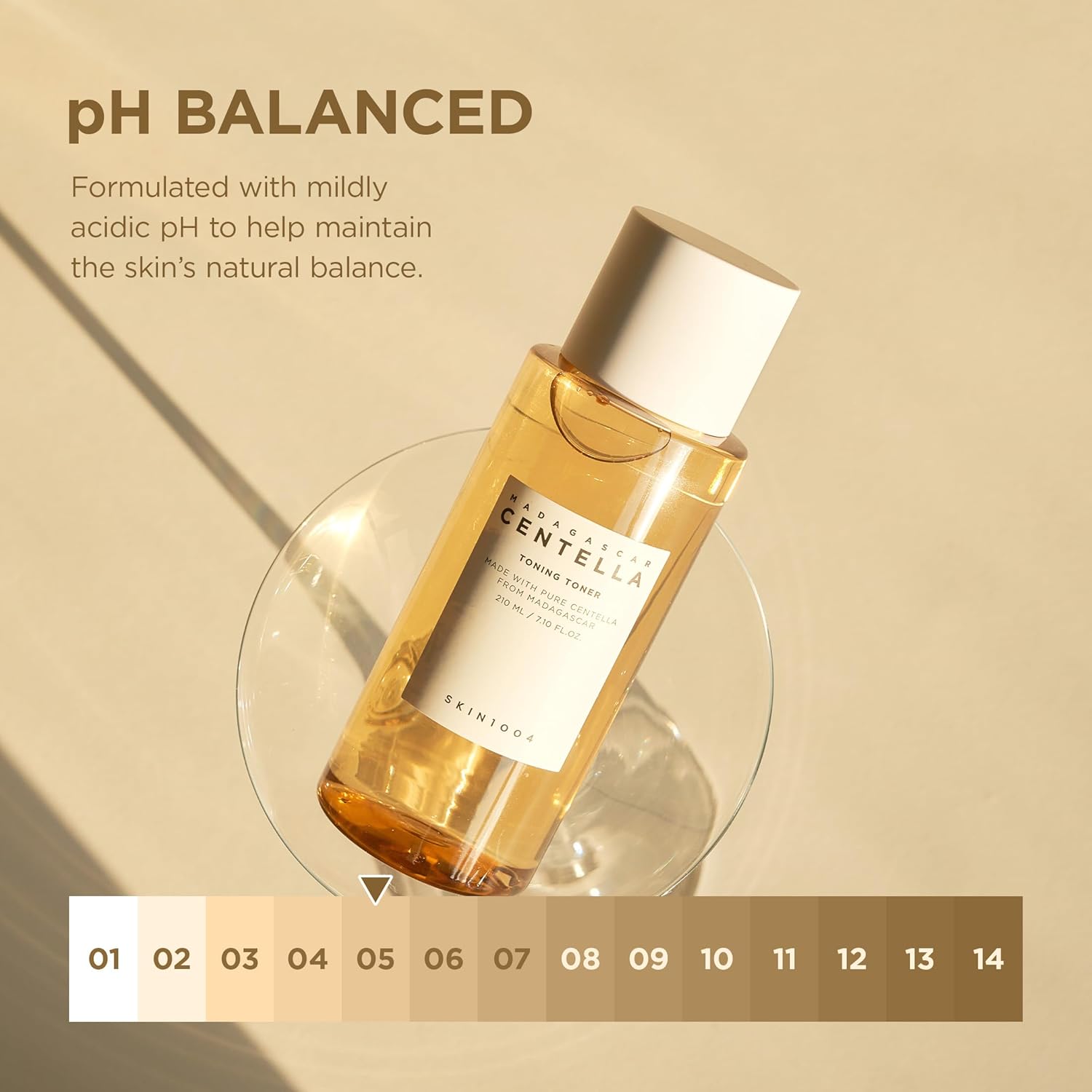 Promotional image of SKIN1004 Madagascar Centella Toning Toner 210ml highlighting its pH-balanced formula. Features a toner bottle displayed on a clear glass stand with a pH scale indicating a mildly acidic pH of approximately 5, helping maintain the skin’s natural balance. Enriched with Madagascar Centella Asiatica to soothe, hydrate, and gently exfoliate while supporting a healthy skin barrier. Suitable for sensitive, dry, oily, and combination skin types.