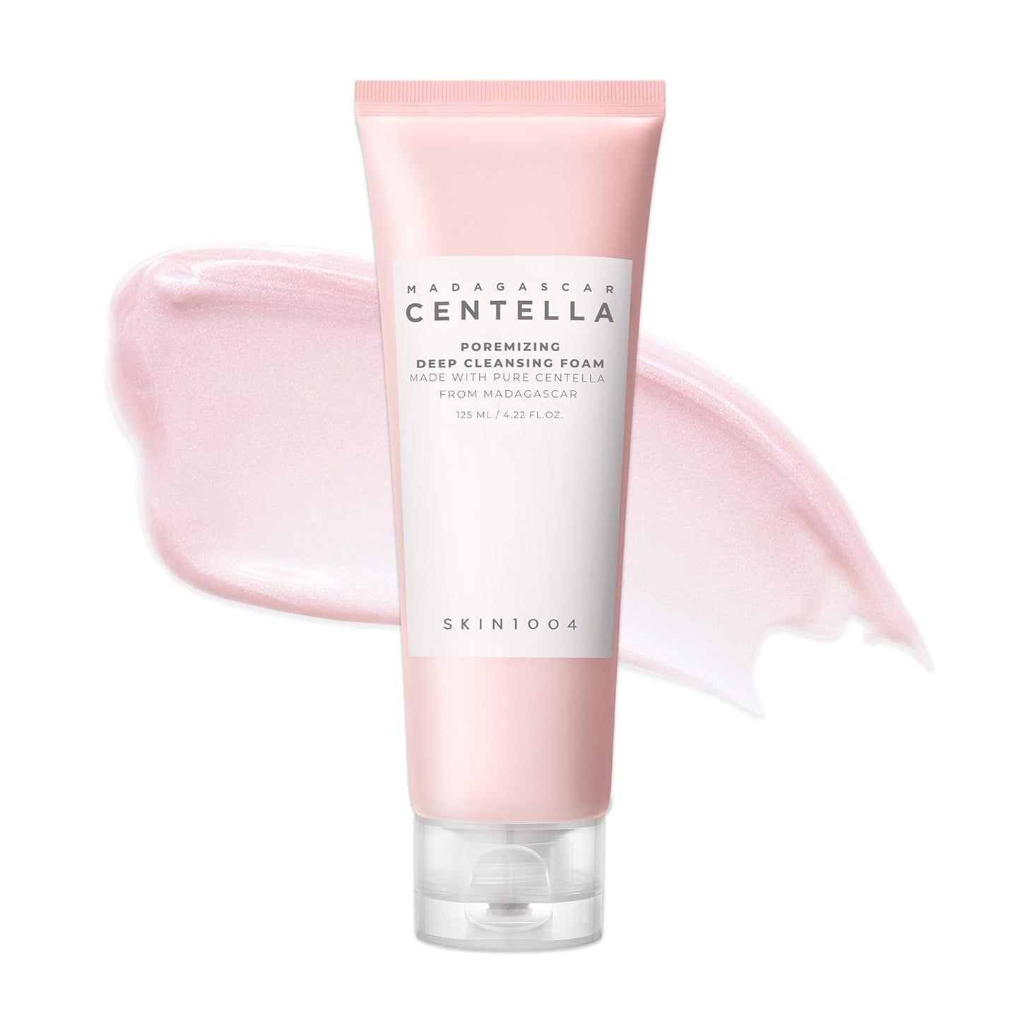 Product image of SKIN1004 Madagascar Centella Poremizing Deep Cleansing Foam 125ml in a pink squeeze tube with a soft pink cream texture swatch in the background. Formulated with Himalayan Pink Salt and Madagascar Centella Asiatica to deeply cleanse pores, remove makeup and impurities, control excess oil, and leave skin feeling clean, smooth, and refreshed without dryness. Suitable for oily, combination, and sensitive skin.