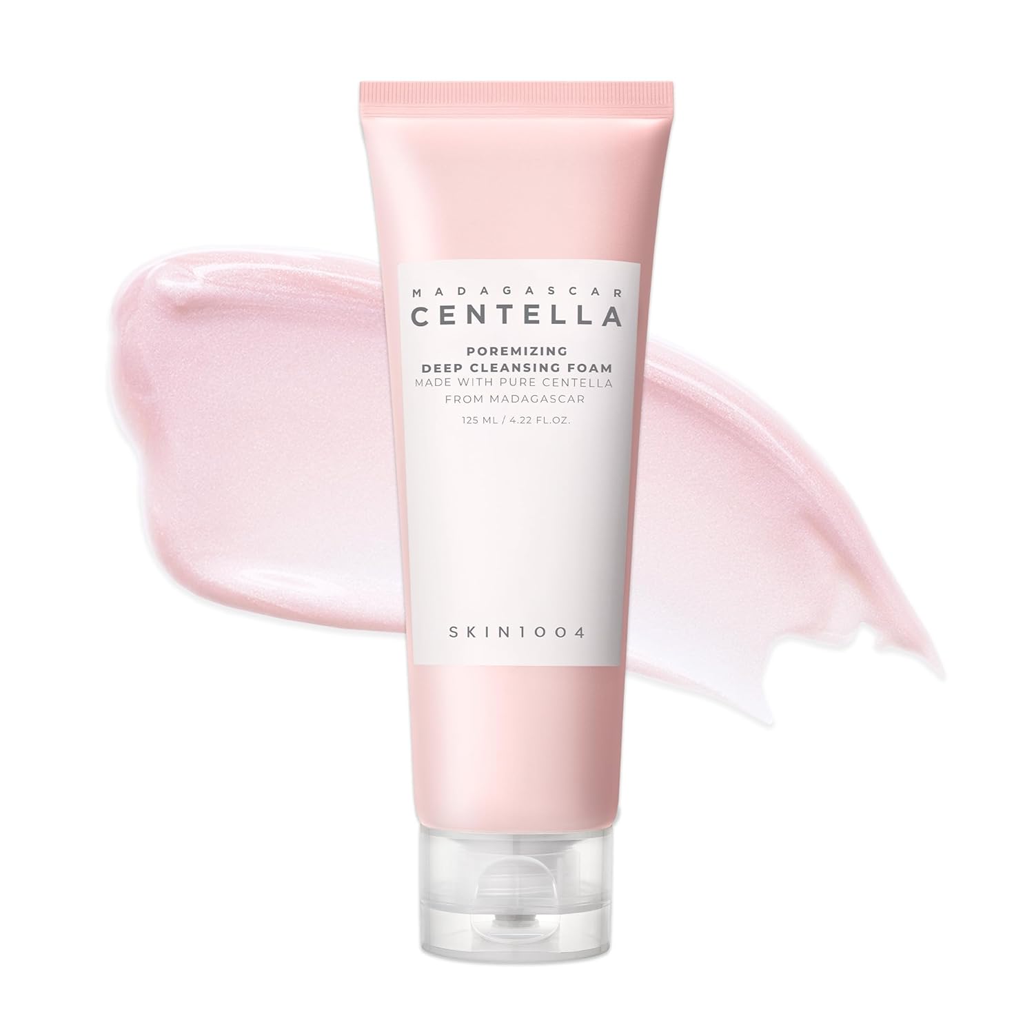Product image of SKIN1004 Madagascar Centella Poremizing Deep Cleansing Foam 125ml in a pink squeeze tube with a soft pink cream texture swatch in the background. Formulated with Himalayan Pink Salt and Madagascar Centella Asiatica to deeply cleanse pores, remove makeup and impurities, control excess oil, and leave skin feeling clean, smooth, and refreshed without dryness. Suitable for oily, combination, and sensitive skin.