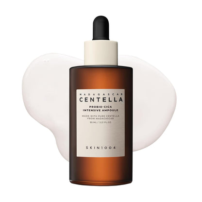 SKIN1004 Madagascar Centella Probio-Cica Intensive Ampoule facial serum in a 95ml amber glass dropper bottle. Korean skincare serum formulated with fermented Centella Asiatica and ceramides to nourish, soothe sensitive skin, strengthen the skin barrier, and provide deep hydration for a healthy, radiant complexion.