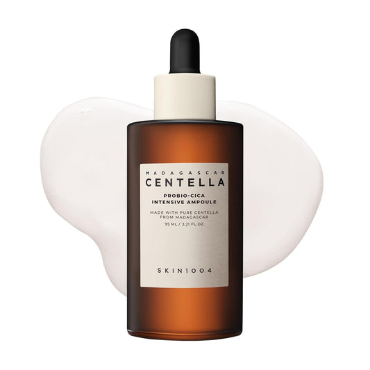 SKIN1004 Madagascar Centella Probio-Cica Intensive Ampoule facial serum in a 95ml amber glass dropper bottle. Korean skincare serum formulated with fermented Centella Asiatica and ceramides to nourish, soothe sensitive skin, strengthen the skin barrier, and provide deep hydration for a healthy, radiant complexion.