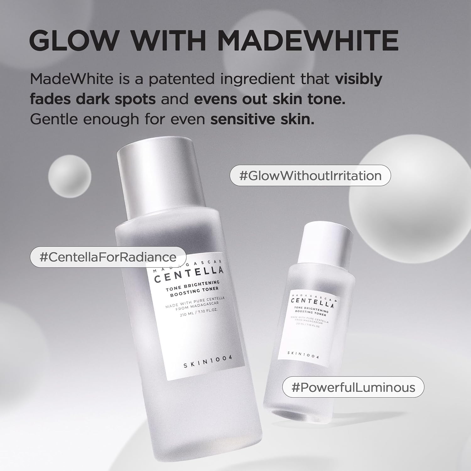 Promotional image of SKIN1004 Madagascar Centella Tone Brightening Boosting Toner 210ml featuring MadeWhite technology for brighter, more even-looking skin. Formulated with Madagascar Centella Asiatica, Niacinamide, and MadeWhite to help visibly reduce the appearance of dark spots, improve skin radiance, and balance uneven skin tone. The gentle Korean toner is suitable for sensitive skin and delivers hydration while supporting a healthy, luminous complexion without irritation. Ideal for dull, uneven, and se