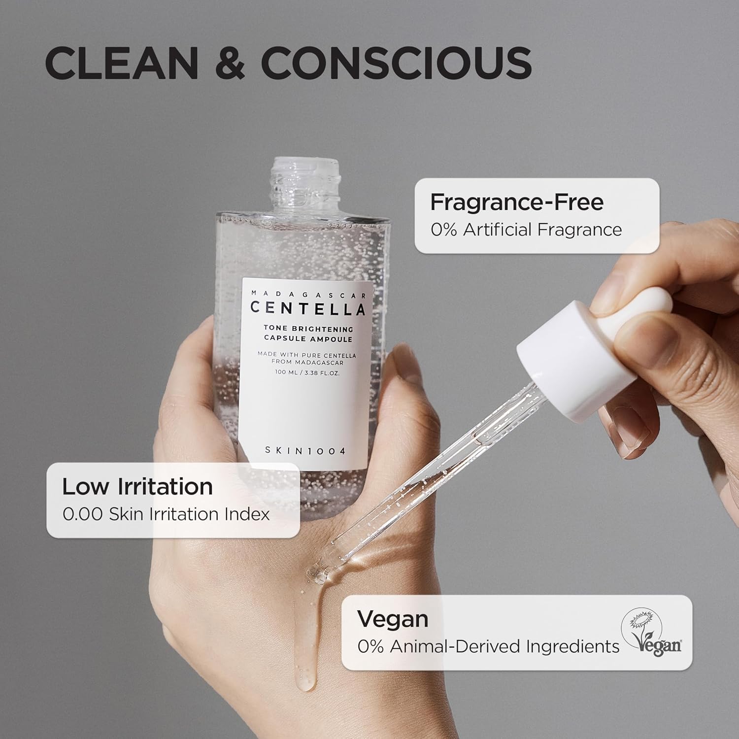 SKIN1004 Madagascar Centella Tone Brightening Capsule Ampoule shown with dropper application. Features a fragrance-free, vegan, and low-irritation formula with 0% artificial fragrance and 0% animal-derived ingredients, making it suitable for sensitive skin while helping brighten and hydrate the complexion.
