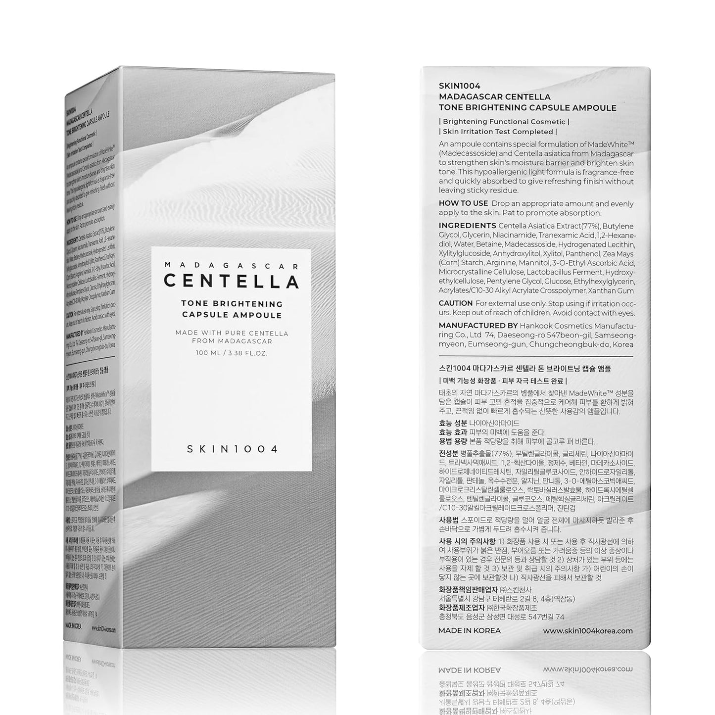 Front and back view of SKIN1004 Madagascar Centella Tone Brightening Capsule Ampoule 100ml retail packaging. The box features a minimalist white desert-inspired design and includes product information, ingredients, usage instructions, and brightening benefits powered by Centella Asiatica, Niacinamide, Tranexamic Acid, and MadeWhite™ technology.