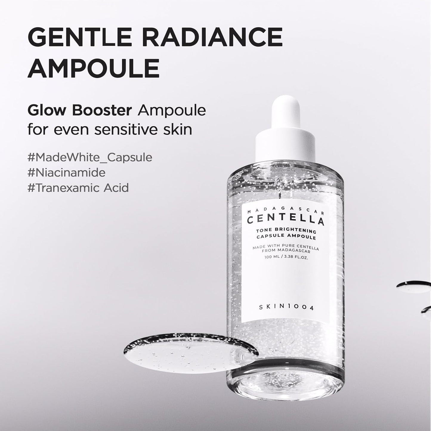 Promotional image of SKIN1004 Madagascar Centella Tone Brightening Capsule Ampoule 100ml featuring Niacinamide, Tranexamic Acid, and MadeWhite™ capsules. Highlights gentle radiance, glow-boosting benefits, and suitability for sensitive skin. The serum bottle with visible brightening capsules is displayed on a clean white background with a glossy serum texture swatch.