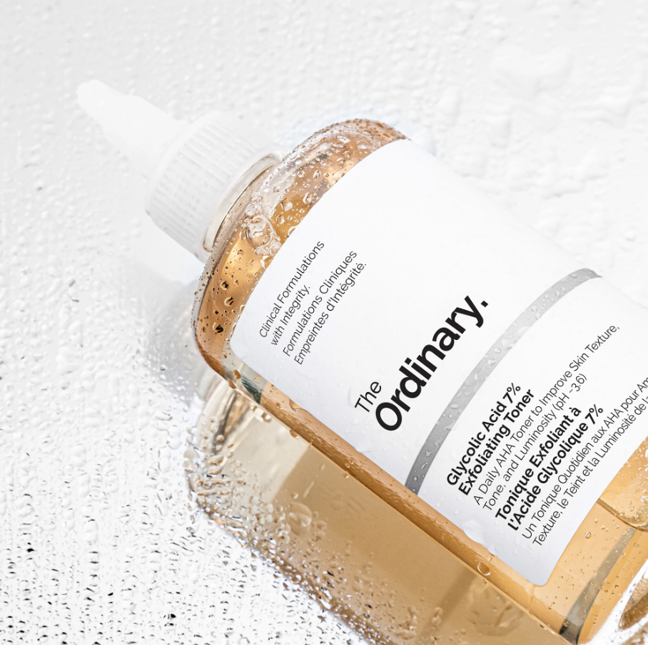 Bottle of 'The Ordinary' toner with a white label on a textured white background